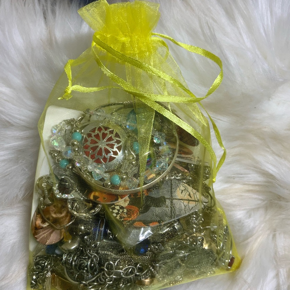 Yellow Organza Bag with Assorted Jewelry